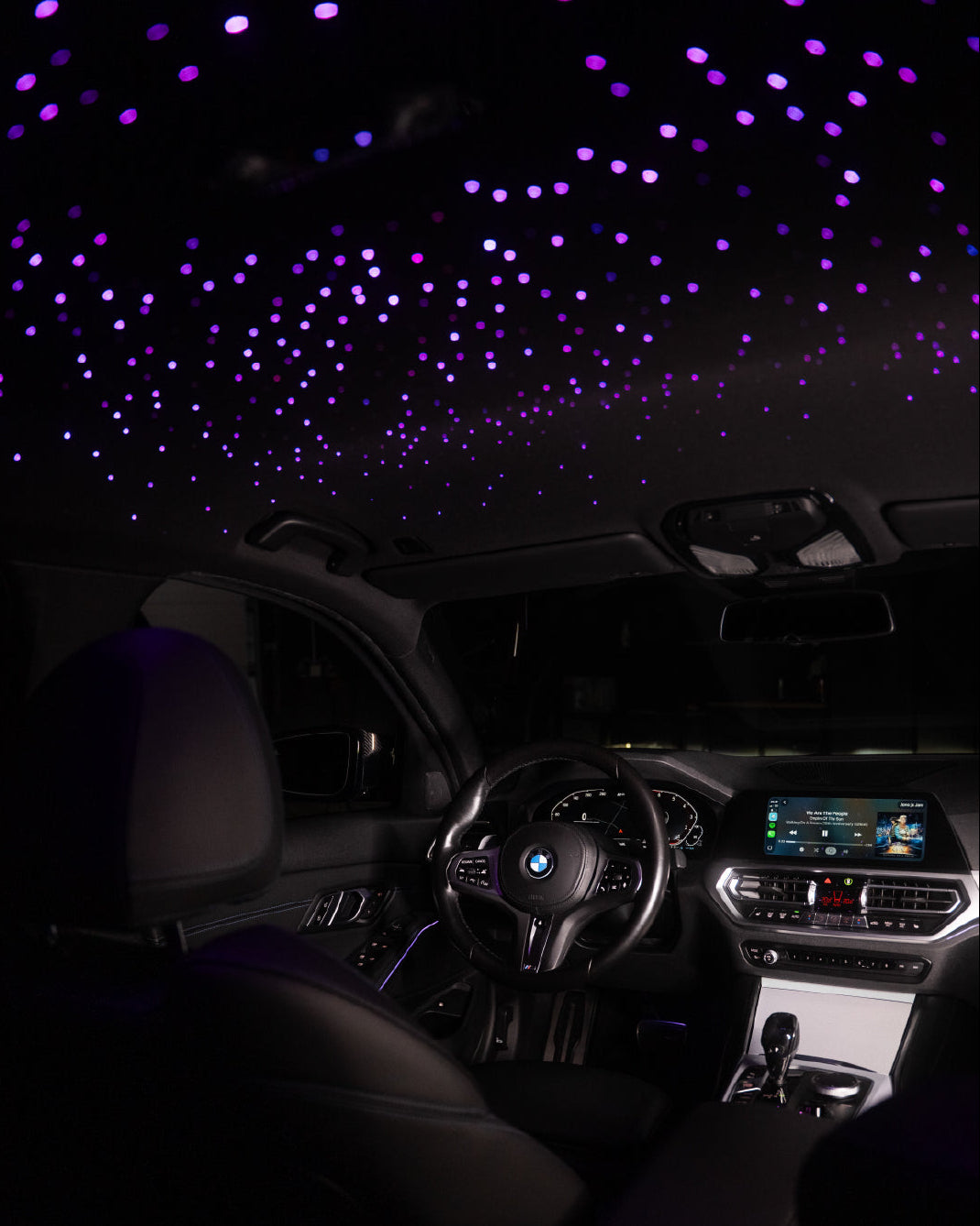 Car interior with starlight projection on the ceiling